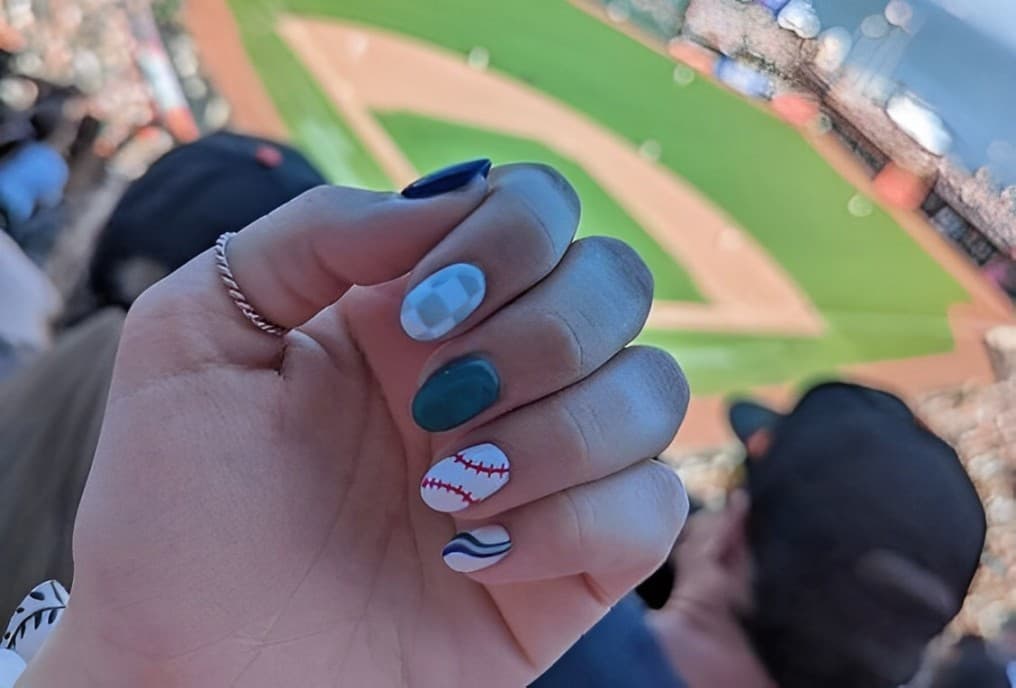 Oval Gray And White Checkered Nail, Dark Blue And Baseball Stitch Design