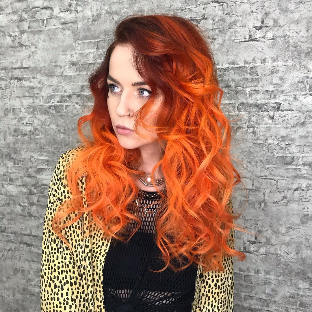 orange hair dark roots with bright orange curls CA2OirTJssX