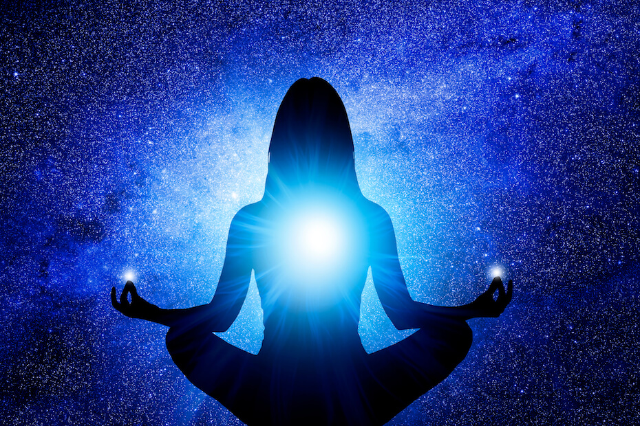 shutterstock woman meditating galaxy blue aura 060719