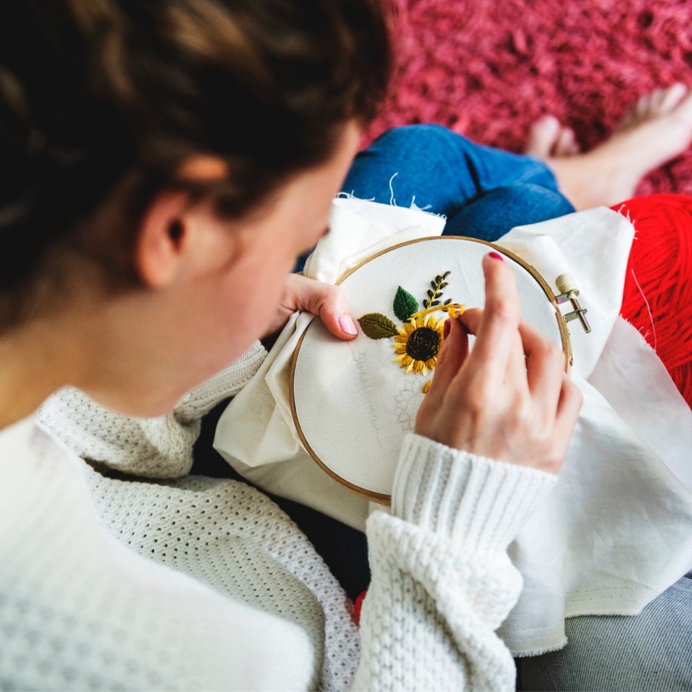 young girl doing some needlework picture id947763298