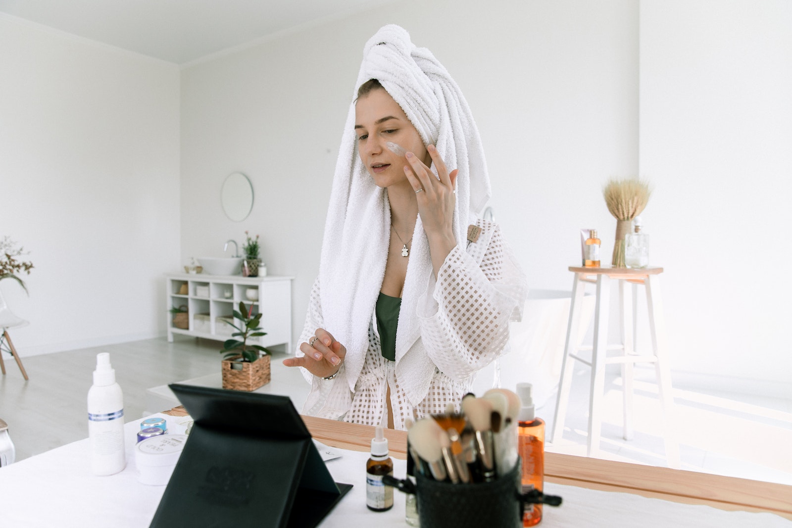 Photo Of Woman Applying Cosmetics On Her Face