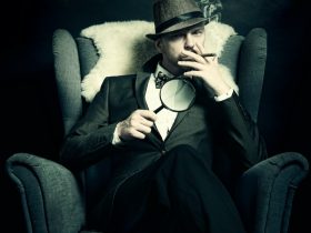 a man sitting in a chair smoking a cigarette