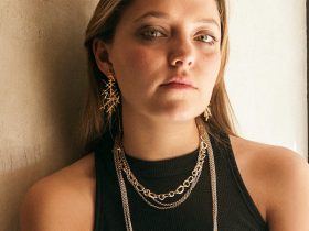woman in black tank top wearing silver necklace