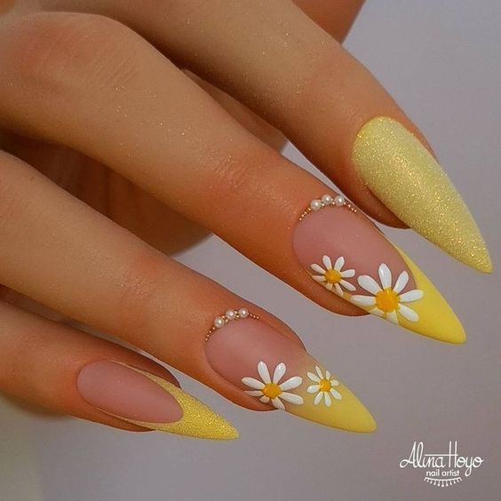 Nude Stilletto Nails With Yellow French Glitter Mani And Daisy Design With Pearls