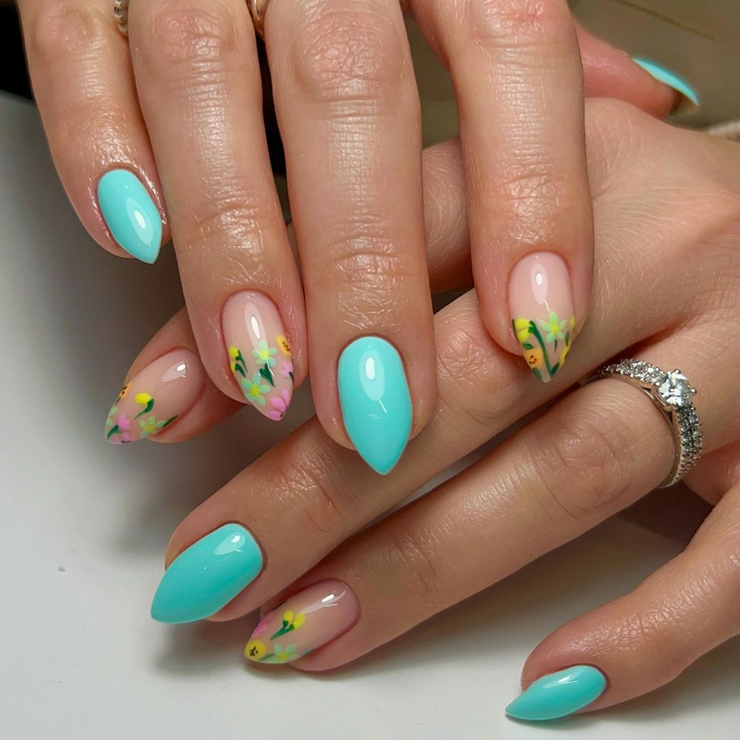 Solid Blue Arrow Nails With Accent Floral Tips