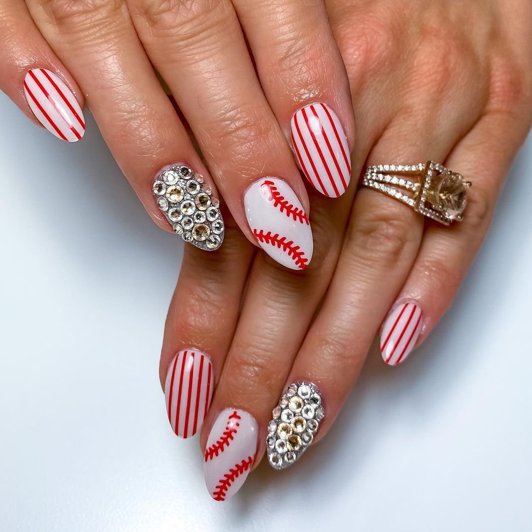 Almond Nails With Red Stripes, Red Baseball Stitches And Diamond Studs