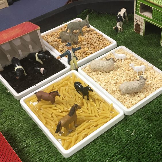 Animal Farm Sensory Bin With Pasta Cereal Mud And Sawdust