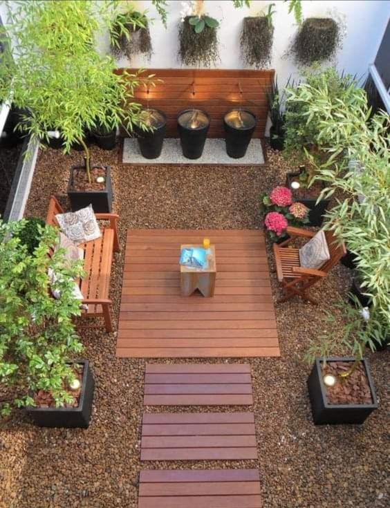 Brown Gravel Patio With Pank Table Base