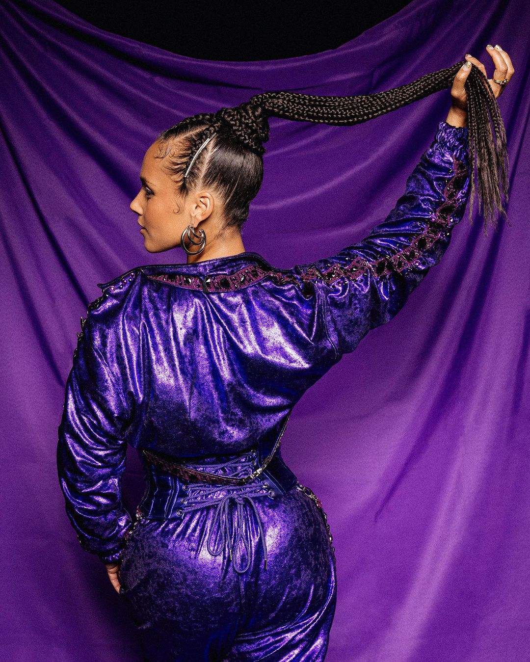 Cornrows With Micro Braids In A Long Wrap-Around Ponytail