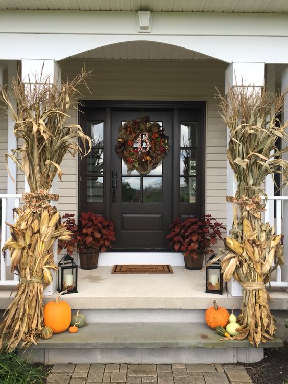 Fall Porch Decor With Corn Stacks, Potter Plants, Lanters, Pumpkins And Wreath