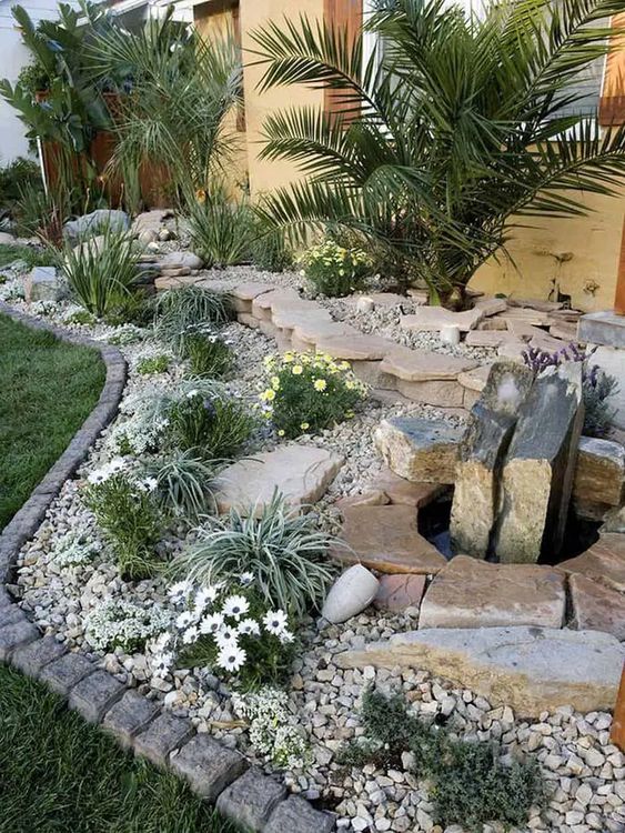 Garden Flat Stones, Pebbles With Palm, Plants and Water Feature