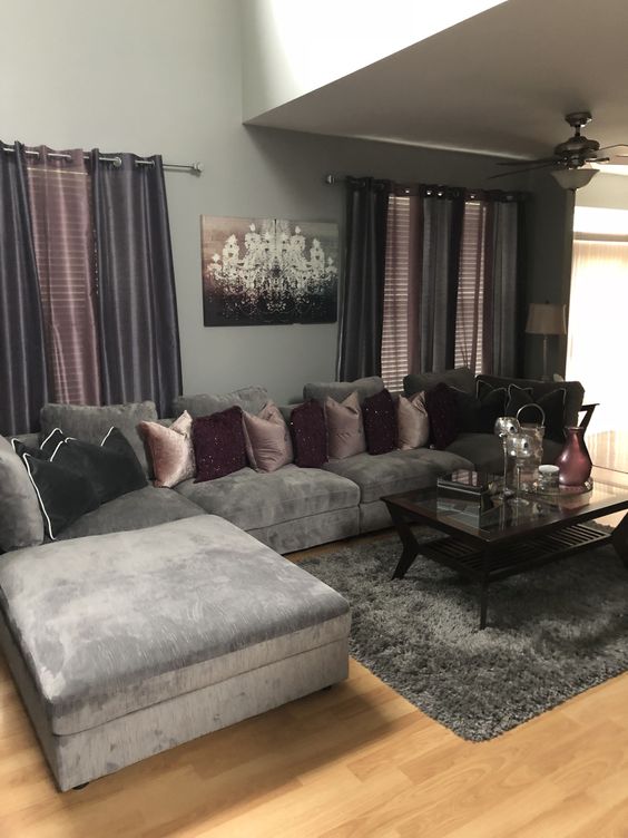 Livingroom Eith Plush Gray Sofa With Pink And Purple Pillows, Pink And Grat Curtains