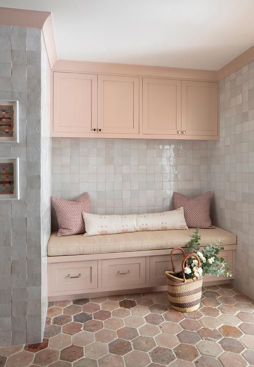 Mudroom With Pink Cabinets And Gray Wall Tiles