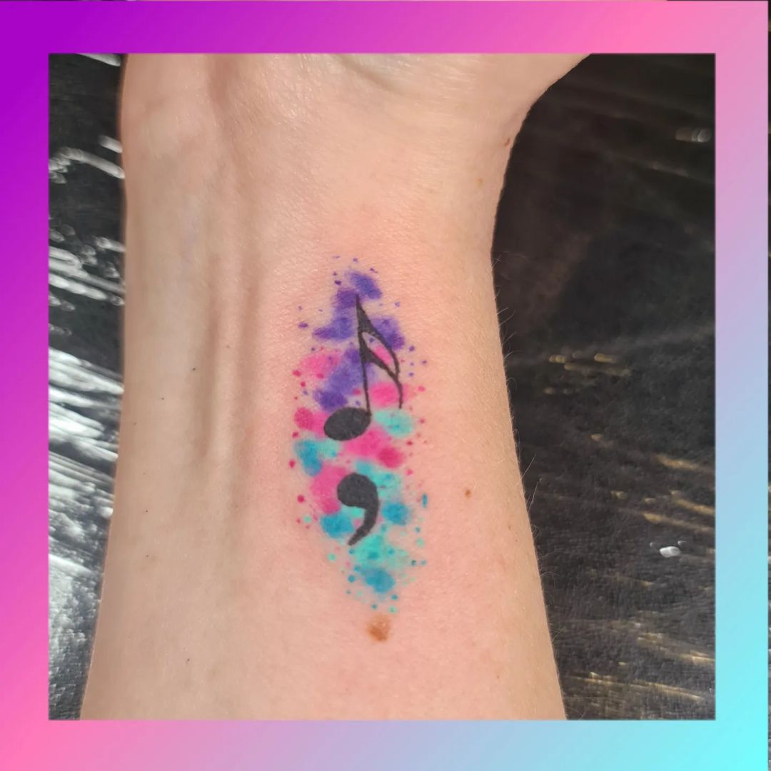 Musical Note Semicolon With Blue And Pink Splashes