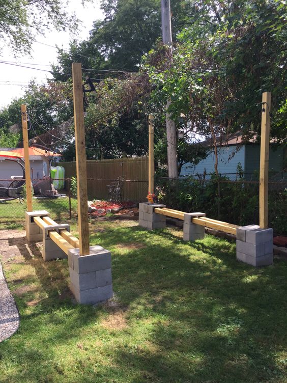 Outdoor Backyard Seating With Cinderblocks And Wooden Posts
