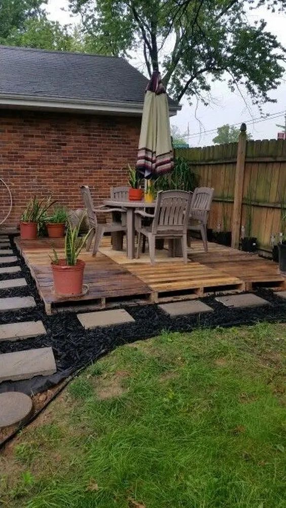 Pallete Patio On Mulc And Steping Stones
