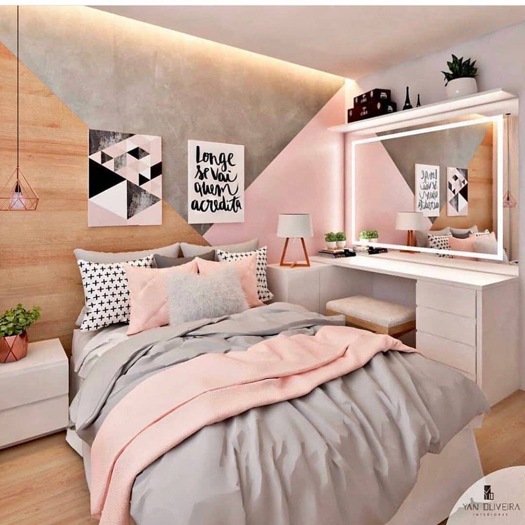 Pink And Gray Bedroom With Wood And White Accent Pieces