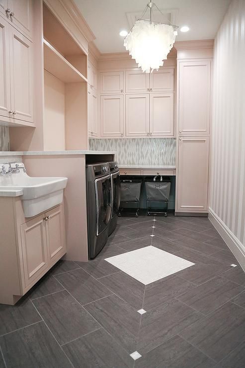 Pink Laundry Room With Gray Tiles And Appliances