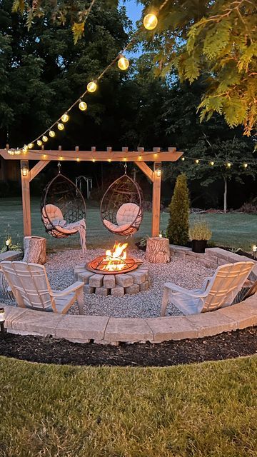 Round Lowered Patio With Fire Pit And Swinging Chairs