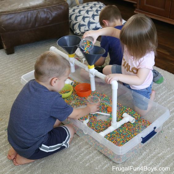 Sensory Play with Funnels, Tubes, and Colored Beans