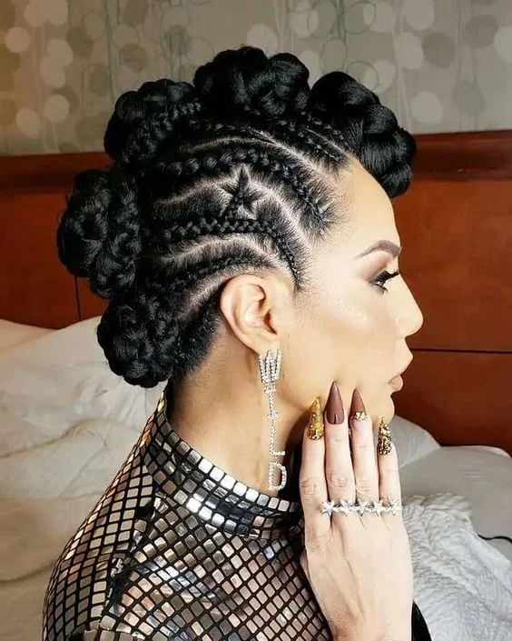 Side Goddess Cornrows With Star Design And Mohawk Buns