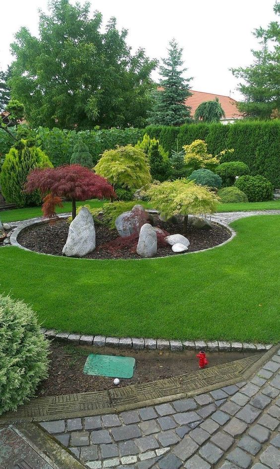 Smal Garden With Trees And Boulders