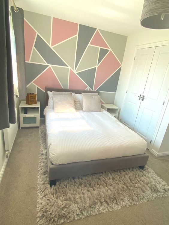 Small Bedroom With Gray bed, Pink Bedding And Geometric Wall Mural