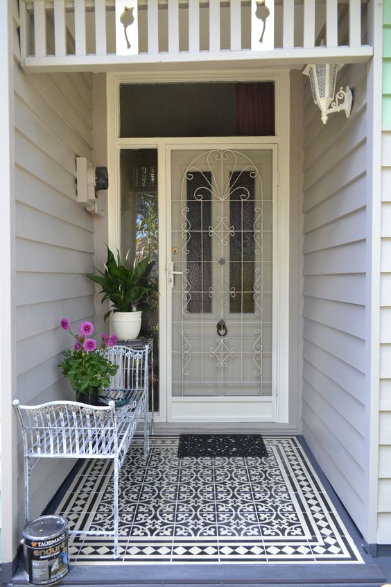 Tiled Porch With Industrial White Bench And Door Grid