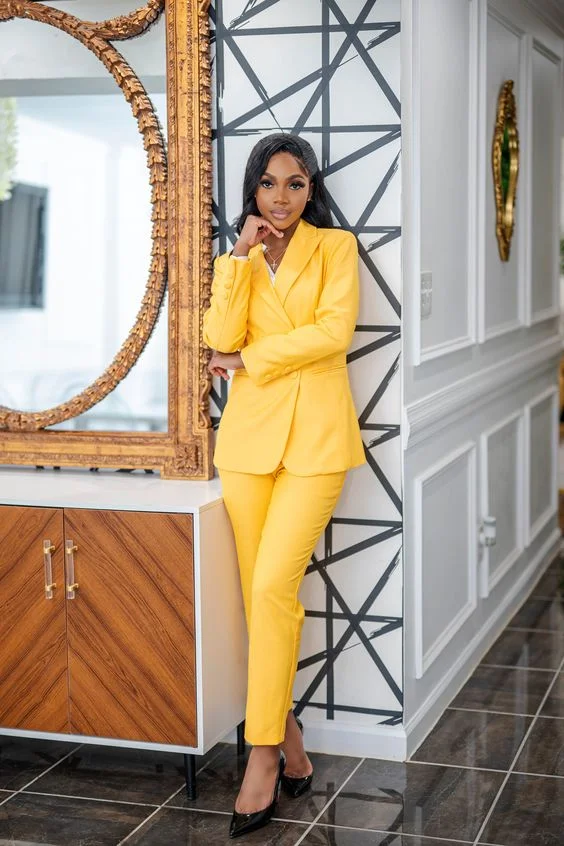 Yellow Power Suit With Black Pumps And White Blouse
