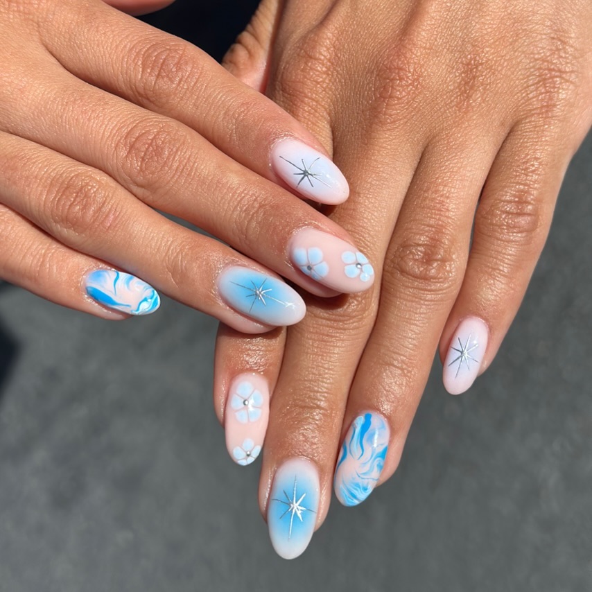 Baby Pink Oval Nails With Blue Stars, Waves And Flowers