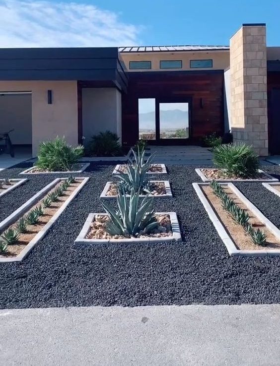 Black Pea Gravel Backyard With Edged Succulent Flower Beds