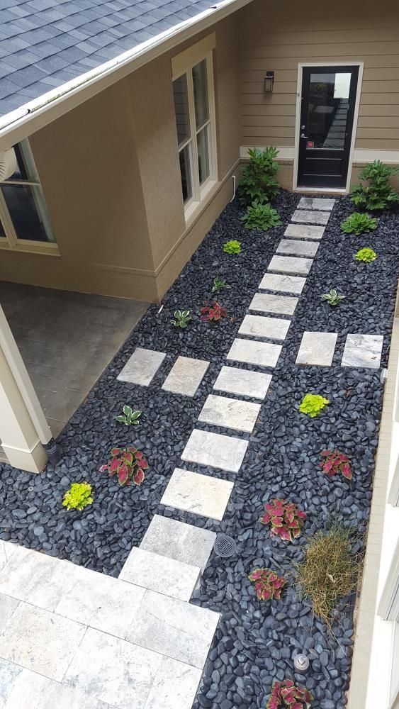 Black Rock Succulent Walkway With White Stepping Stones