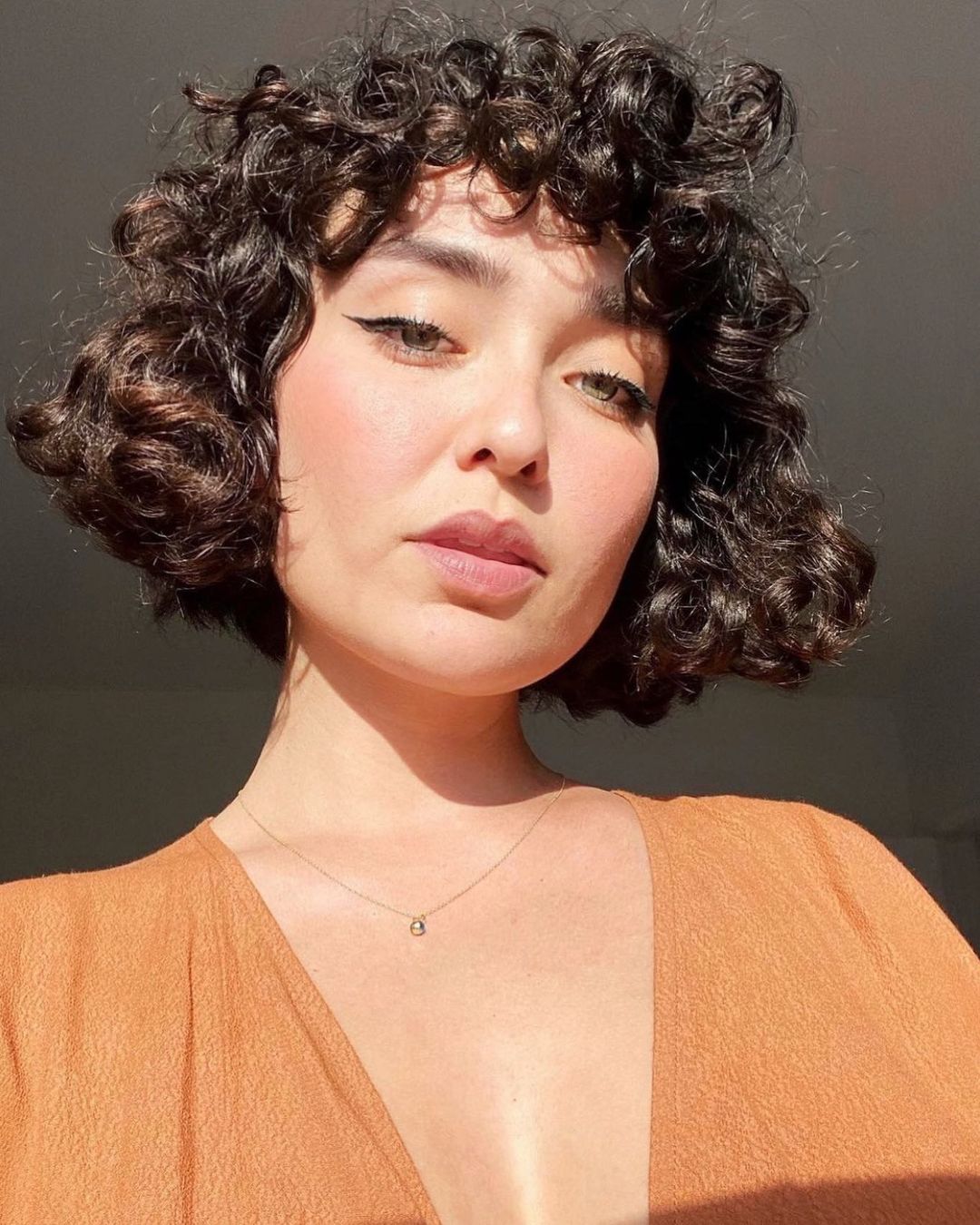 Curly Razor Cut French Bob