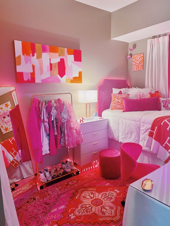 Dark Pink Furniture With Pink Headboard And Orange Wall Art And Pillows