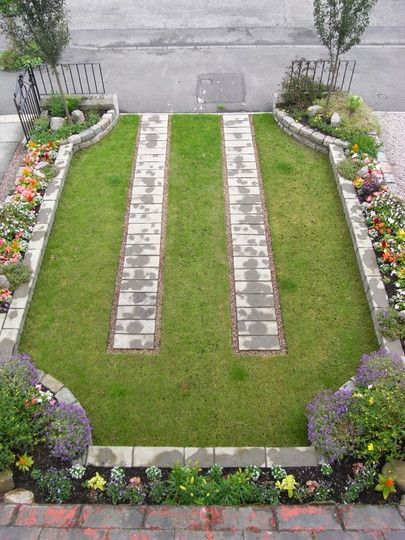 Grassy-Driveway-With-Pavers-Flower-Beds-With-Brick-Edgers-And-Oron-Gate