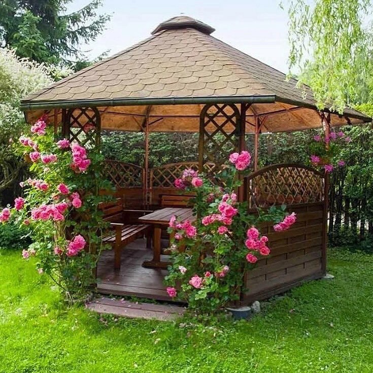 Hexagonal Gazebo With Trellis Walls And Rose Vines