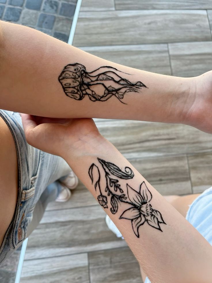 Jellyfish And Dafodil Design On Forearm