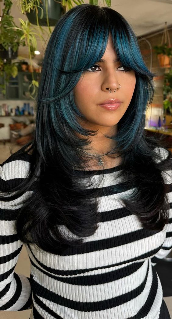 Long Layered Butterfly Cut With Blue Face Framing Highlights