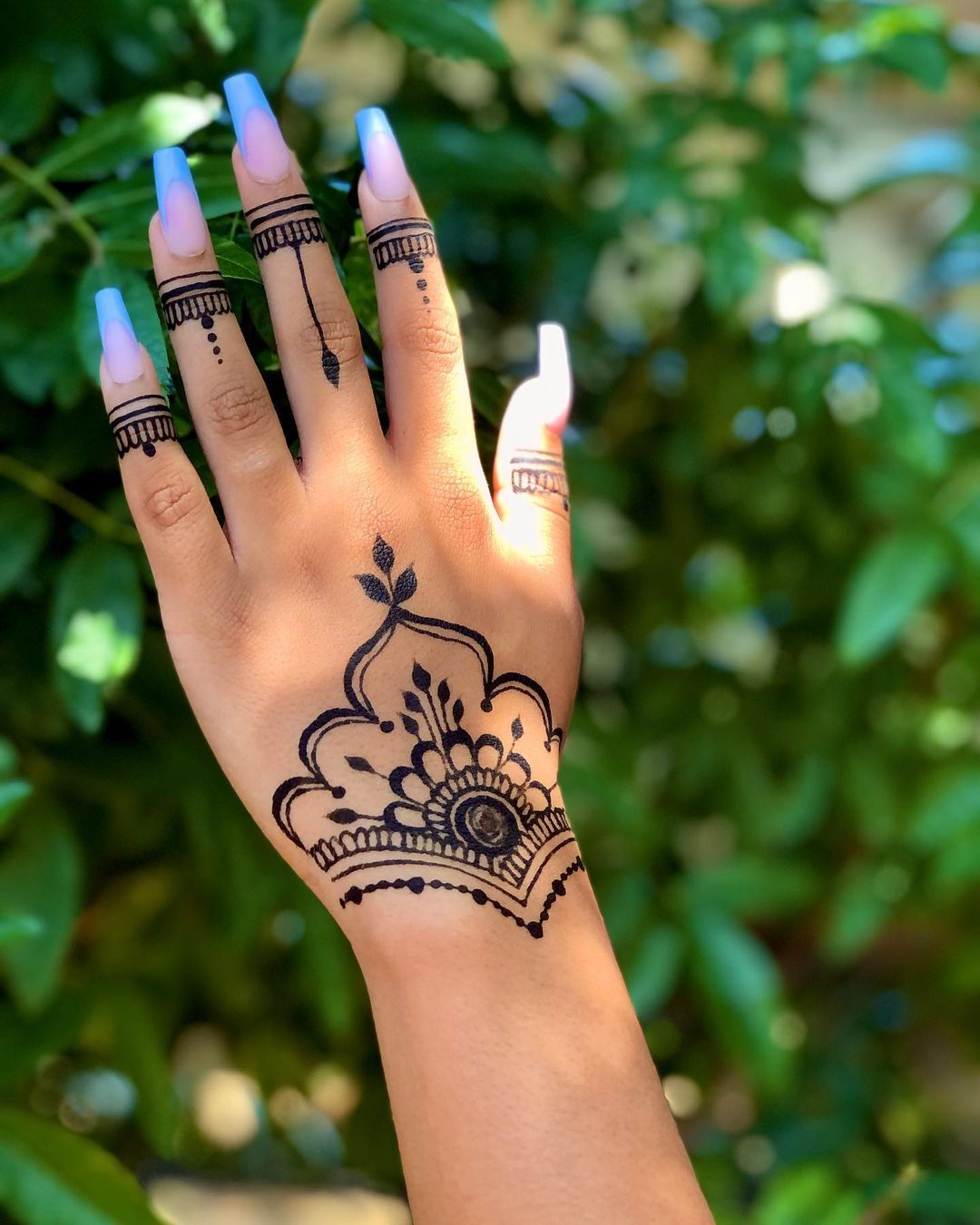 Mehndi Flower on Wrist And Ring Design On First Finger Joints