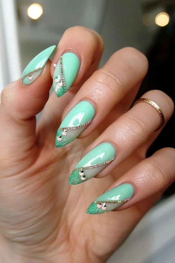 Mint Green Almond Nails With Silver Rhinestones And Glitter tips