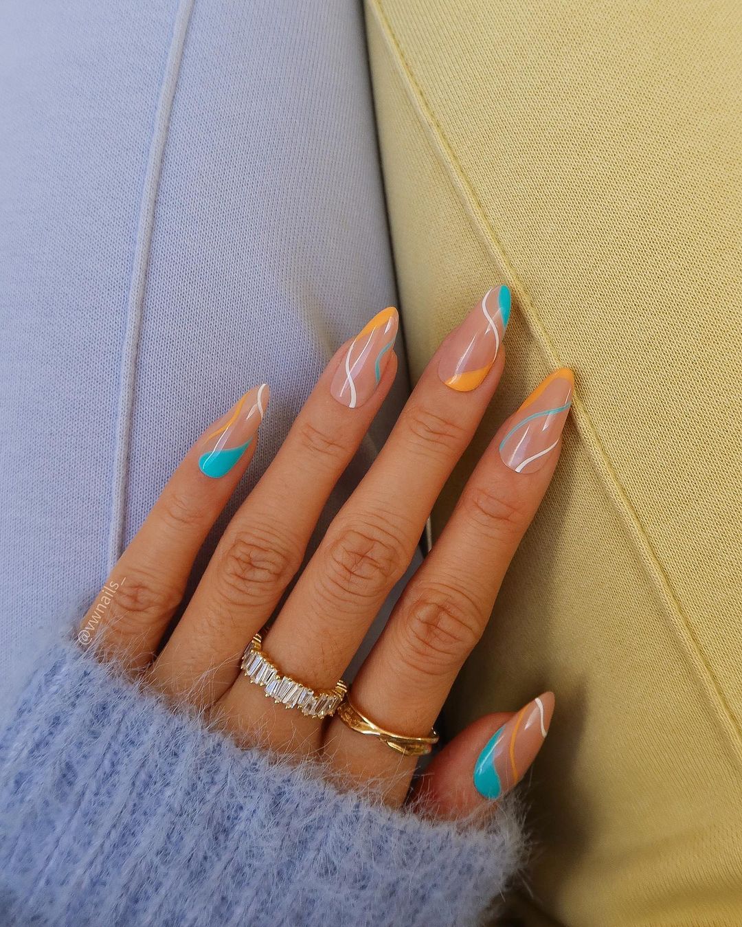 Nude Nails With Delicate White, Orange AndBlue Lines