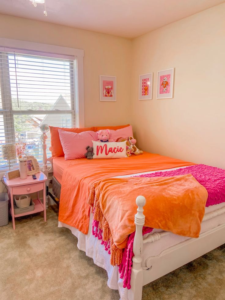 Orange Covers And Headboard With Pink Blanket, PIllow And Nightstand