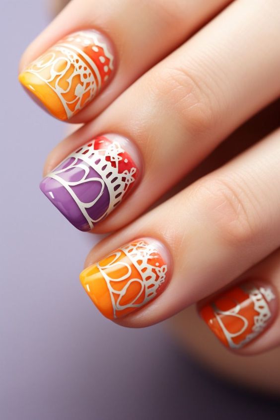 Orange, Purple And Red Nails With White Designs