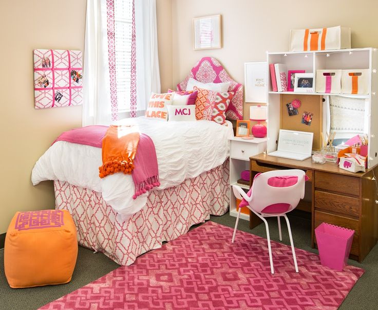 PInk Patterned Carpet, Headboard And Bed Cover With Orange Pillows And Bean Bag