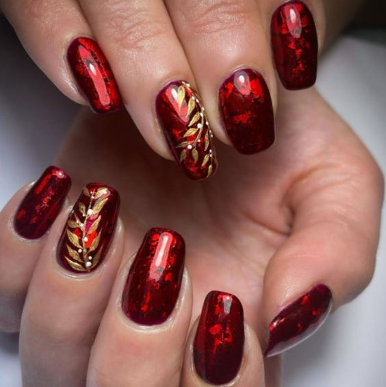 Ruby Sequoval Nails With Gold Vine Design