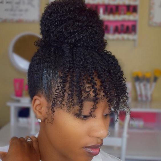 Top Bun Coily Updo With Bangs