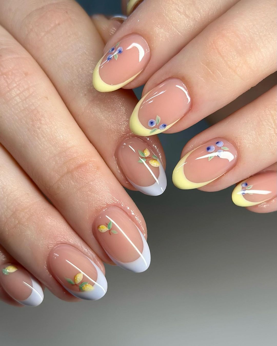 Yellow And Baby Blue French Many On Oval Nails With Delicate Fruit Designs