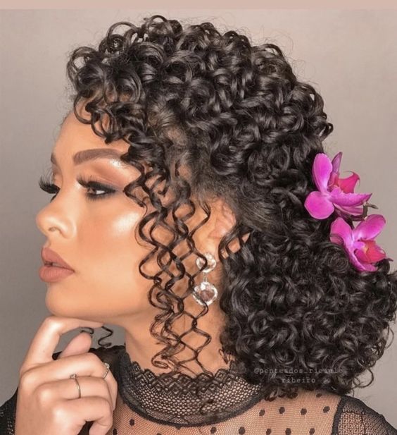 Curly-Low-Bun-With-Side-Swept-Loose-Bangs