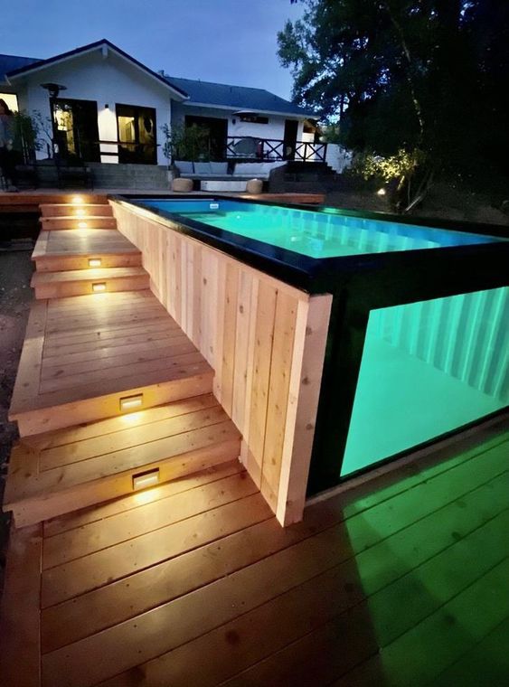 Glass And Metal Above-ground Pool With Decked Stairs