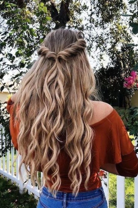 Lonh Blonde Wavy Hair With Twisted Pinned Back Braids